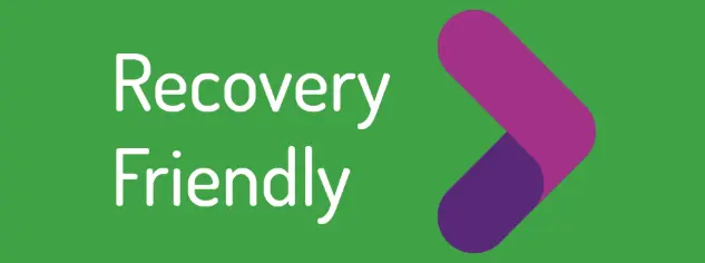 Recovery Friendly logo: the words Recovery Friendly in white beside a magenta and purple chevron on a green background